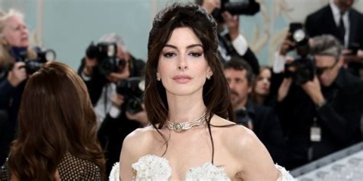 Anne Hathaway in tweed & pearl Versace at the Met Gala: stunning?