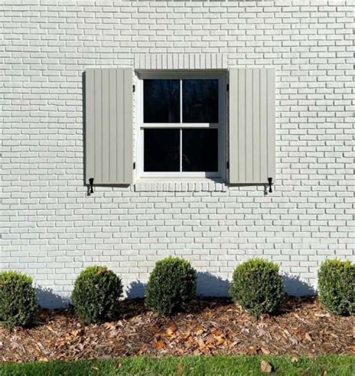 Can you put wood shutters on vinyl siding?