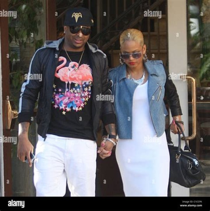 Christina Milian with her boyfriend, Matt, she is smiling at the camera and he is looking at her adoringly