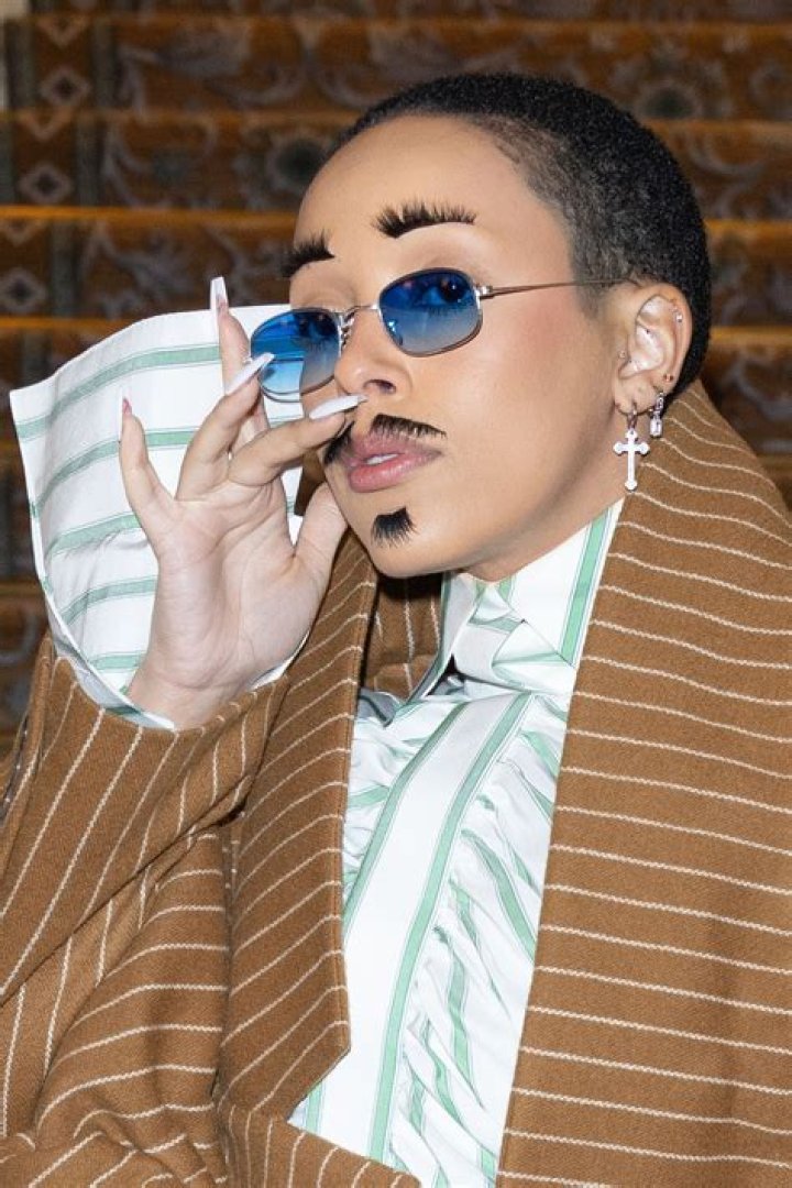 Doja Cat Wears False Eyelashes as a Mustache at Paris Fashion Week