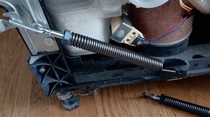How do I fix the spring on my LG dishwasher?