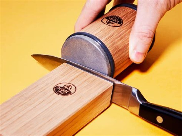 How do you use a handheld knife sharpener?