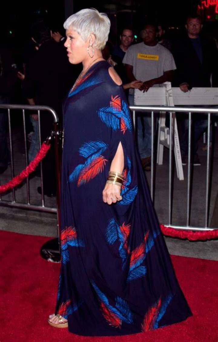 Pink swaddles her bump in a navel-grazing muumuu: disturbing or cute?