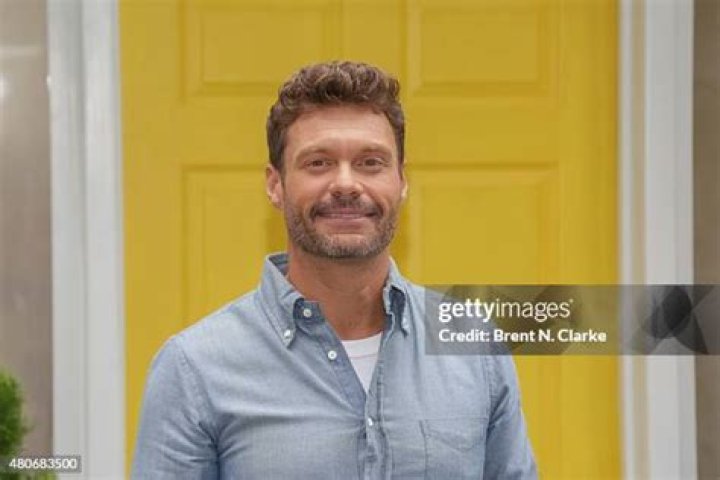 Ryan Seacrest poses for photographs as he arrives for Khloe Kardashian and Lamar Odom's wedding